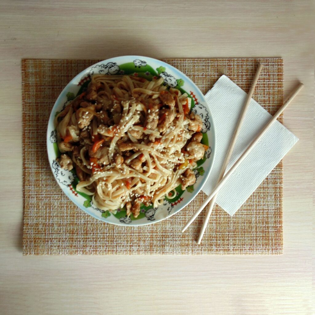 pasta dish in blue and white ceramic bowl